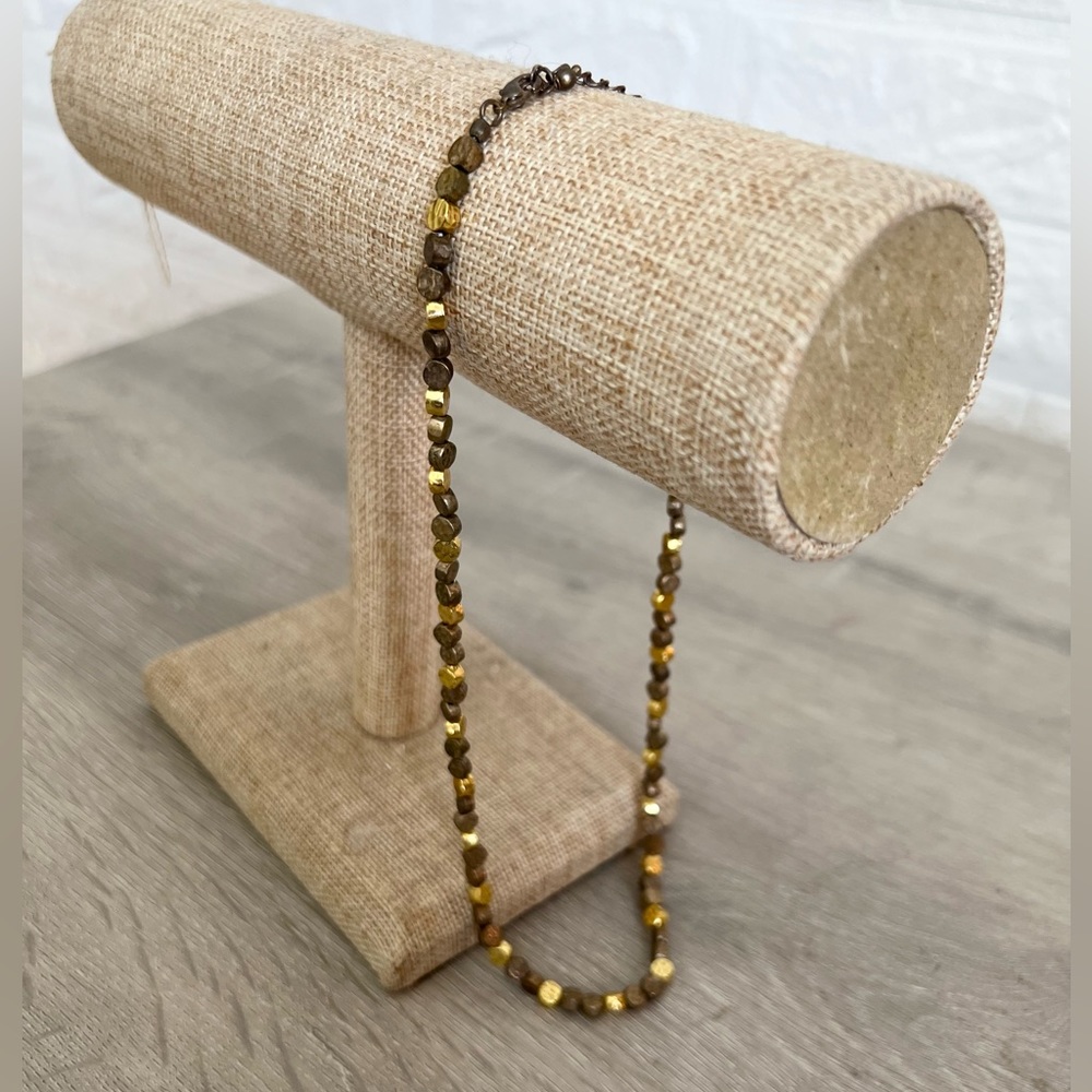 Gold and pewter beaded choker style necklace.